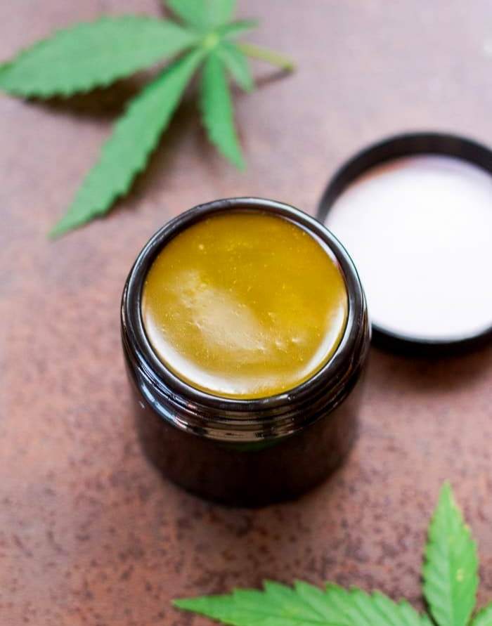cannabis salve with cannabis leaf