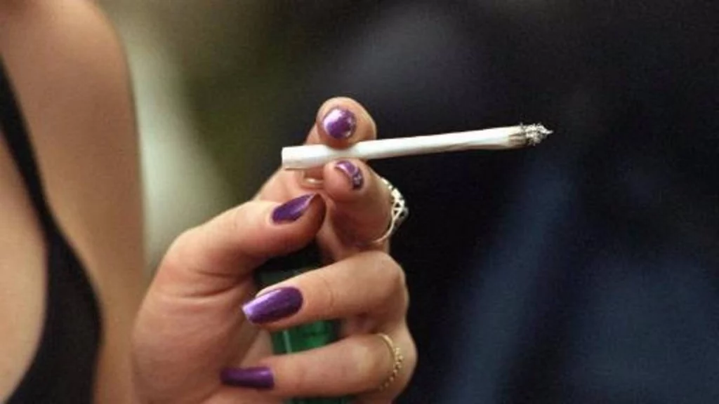 woman holding a joint
