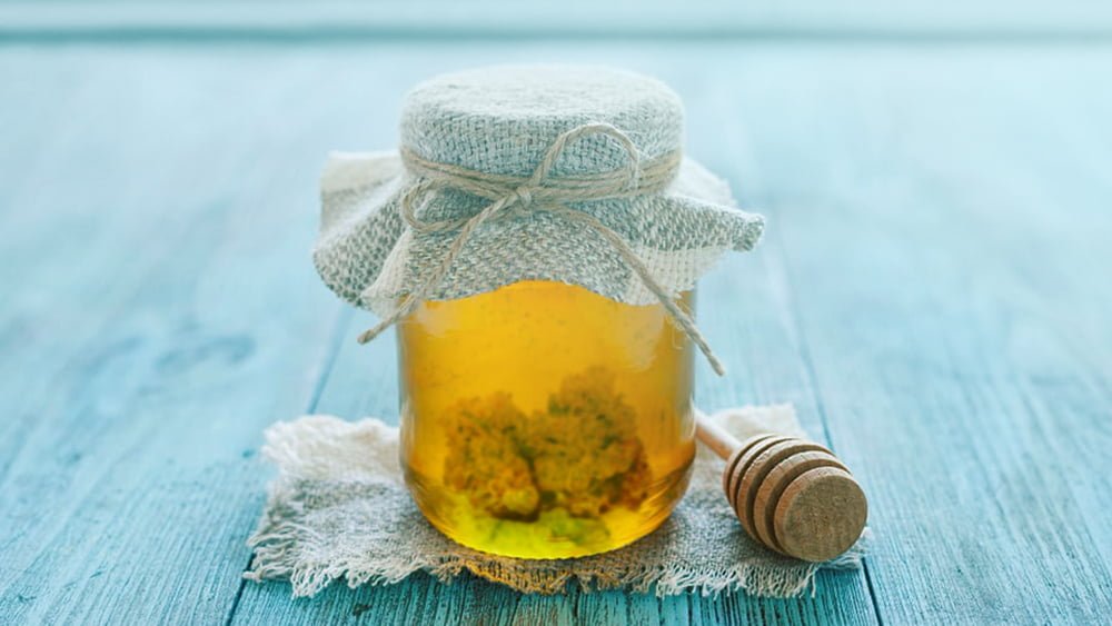 Honey with cannabis flowers